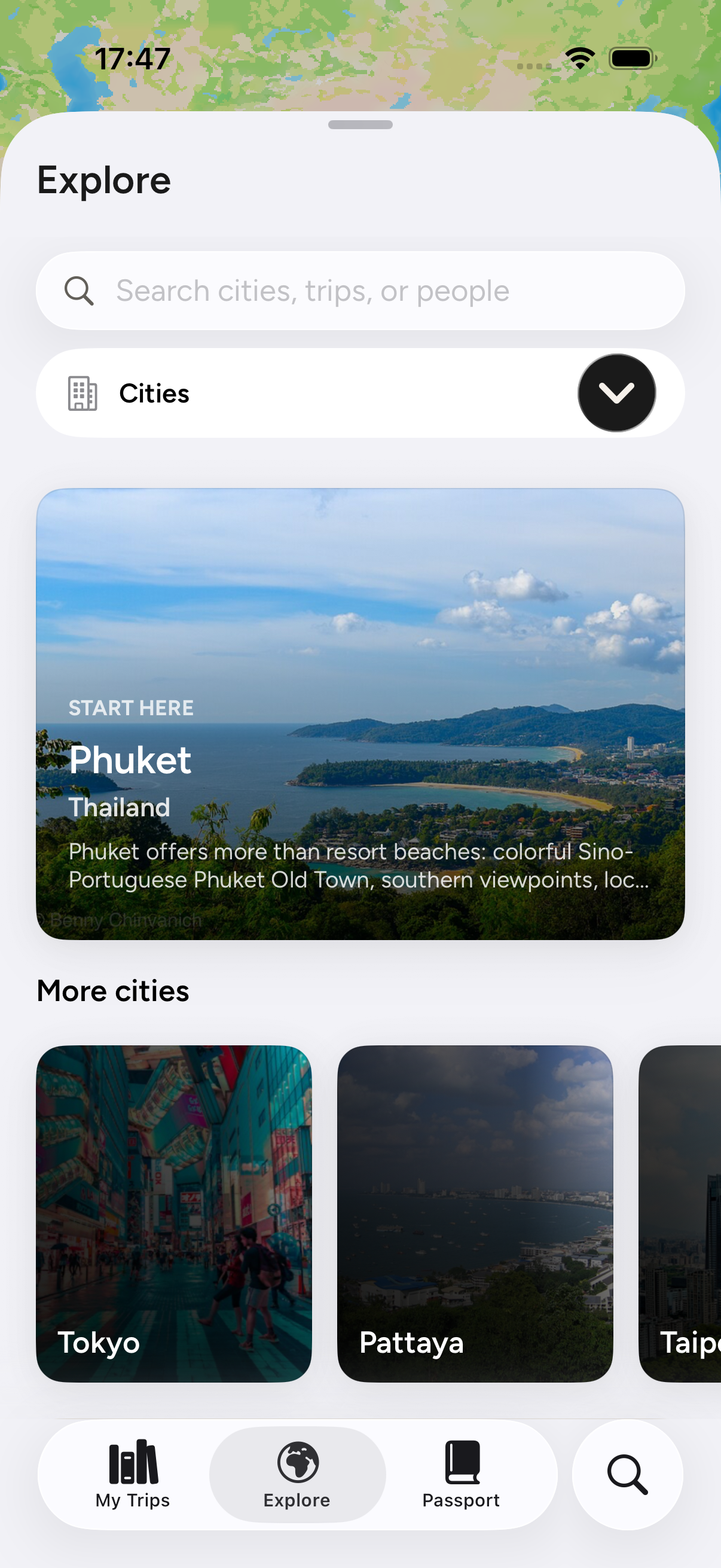 Wayvie Explore with full-image Phuket and Tokyo destination cards and My Trips, Explore, Passport and Search navigation.