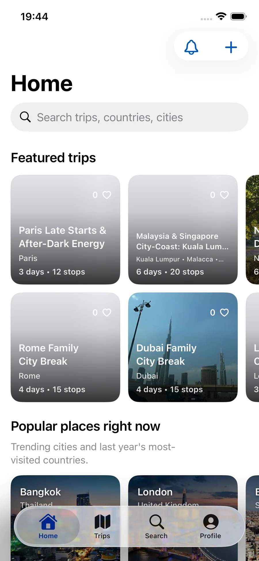 Waypoint Home showing featured trips, popular destinations, search, and the native iPhone tab bar.