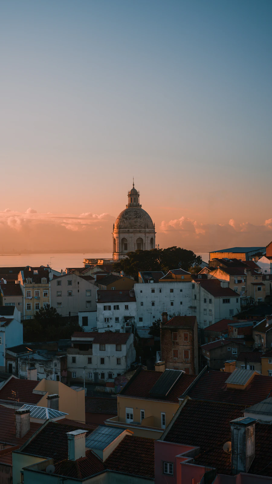 Sunset over Lisbon’s rooftops and the Tagus River